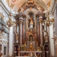 The altar of the Church of St Stephen, flanked by statues of Saints Peter and Paul.